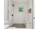 Modern walk-in shower with stylish tile work, rainfall shower head, and convenient built-in bench at 4451 Flat Shoals Pkwy, Decatur, GA 30034