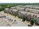 Aerial view of many newly constructed townhouses in a well-planned community at 4458 Dunblane Ave, Sugar Hill, GA 30518