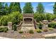 Attractive brick and stone Hadley Township community sign surrounded by lush landscaping at 4458 Dunblane Ave, Sugar Hill, GA 30518