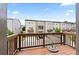 Rear deck with wood railing overlooking the backyard and neighborhood at 4458 Dunblane Ave, Sugar Hill, GA 30518