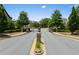 Entry gate to a lovely residential community, surrounded by landscaped gardens at 4458 Dunblane Ave, Sugar Hill, GA 30518