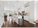 Bright kitchen with stainless steel appliances, granite countertops, and an island with seating at 4458 Dunblane Ave, Sugar Hill, GA 30518