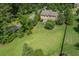 Expansive green lawn in an aerial view showcases the home and outdoor entertaining area at 4547 Meadow Green Nw Ln, Acworth, GA 30101