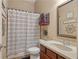 Functional bathroom with a combination shower and tub, single sink vanity, and neutral decor at 4547 Meadow Green Nw Ln, Acworth, GA 30101