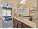 Bright bathroom featuring a large vanity with a stone countertop, a huge mirror and stylish décor at 4547 Meadow Green Nw Ln, Acworth, GA 30101