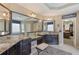Bathroom features double vanity with granite counters and access to a large walk-in closet at 4547 Meadow Green Nw Ln, Acworth, GA 30101