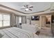 Spacious bedroom with sitting area, ceiling fan, and large windows providing natural light at 4547 Meadow Green Nw Ln, Acworth, GA 30101