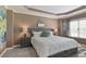 Bedroom featuring a bed with decorative pillows and a gray headboard and matching side tables at 4547 Meadow Green Nw Ln, Acworth, GA 30101