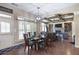 Open-concept dining room adjacent to the living room, with views of the backyard at 4547 Meadow Green Nw Ln, Acworth, GA 30101