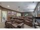 A cozy home theater with tiered leather seating, movie posters, and a wet bar for ultimate entertainment at 4547 Meadow Green Nw Ln, Acworth, GA 30101