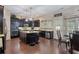 Kitchen features dark cabinets, granite countertops, stainless steel appliances, and a center island with seating at 4547 Meadow Green Nw Ln, Acworth, GA 30101
