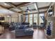 Spacious living room with coffered ceilings, stone fireplace, and plenty of natural light at 4547 Meadow Green Nw Ln, Acworth, GA 30101