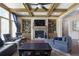 Cozy living room with coffered ceiling, stone fireplace, built-in shelving, and ample seating at 4547 Meadow Green Nw Ln, Acworth, GA 30101
