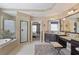 Spacious bathroom features a soaking tub, walk-in shower, double vanity, and access to bedroom at 4547 Meadow Green Nw Ln, Acworth, GA 30101