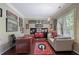Cozy home office featuring a large desk, comfortable seating, and ample natural light at 4547 Meadow Green Nw Ln, Acworth, GA 30101