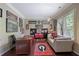 A well-lit office with a wooden desk, comfortable seating, and charming decor at 4547 Meadow Green Nw Ln, Acworth, GA 30101