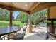 Back patio features outdoor seating, fire pit, and hot tub area perfect for entertaining at 4547 Meadow Green Nw Ln, Acworth, GA 30101