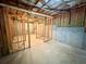 Unfinished basement featuring concrete walls, wood studs, and insulated ceiling ready to be converted into extra living space at 237 Shockley Way, Dallas, GA 30157