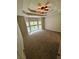 Large bedroom with a tray ceiling, neutral carpet, and bay windows for natural light at 237 Shockley Way, Dallas, GA 30157