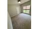 Cozy bedroom features neutral carpet and a large window providing ample natural light at 237 Shockley Way, Dallas, GA 30157