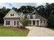 Charming traditional home featuring neutral siding, detailed trim, and a well-manicured front lawn at 237 Shockley Way, Dallas, GA 30157
