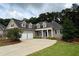 Attractive exterior showcasing a two-car garage and a well-maintained front yard at 237 Shockley Way, Dallas, GA 30157