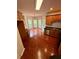Bright kitchen with hardwood floors, stainless steel appliances, and an adjacent breakfast nook at 237 Shockley Way, Dallas, GA 30157