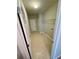 Tiled laundry room with storage shelf and utility connections at 237 Shockley Way, Dallas, GA 30157