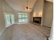 Bright living room with vaulted ceilings, a stone fireplace, and French doors leading to the outside at 237 Shockley Way, Dallas, GA 30157