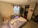View of bedroom with full size bed, decorative tree, side tables, and curtains at 25 Dogwood Dr Nw, Cartersville, GA 30121