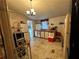 View of the kitchen with chandelier, white cabinets, and appliances at 25 Dogwood Dr Nw, Cartersville, GA 30121