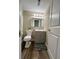 Cozy bathroom featuring a vanity, mirror, and toilet with a patterned rug at 405 Fairburn Sw Rd # 231, Atlanta, GA 30331