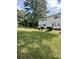 Exterior view of townhomes featuring well-maintained lawn and landscaping at 405 Fairburn Sw Rd # 231, Atlanta, GA 30331