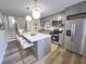 Updated kitchen showcasing stainless steel appliances and a kitchen island with barstool seating at 405 Fairburn Sw Rd # 231, Atlanta, GA 30331