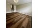 Spacious living room with hardwood flooring, neutral paint, and staircase access at 405 Fairburn Sw Rd # 231, Atlanta, GA 30331