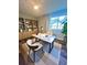 Office space featuring a modern desk setup, shelving, and a large window at 405 Fairburn Sw Rd # 231, Atlanta, GA 30331