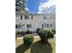 Charming townhome exteriors with well-kept lawns and shrubbery enhance curb appeal at 405 Fairburn Sw Rd # 231, Atlanta, GA 30331