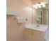 Bathroom featuring a white vanity with storage and wall fixtures at 5287 Wild Indigo Way, Acworth, GA 30102