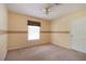 Inviting bedroom with neutral tones, a window with blinds, and a carpeted floor for comfortable living at 5287 Wild Indigo Way, Acworth, GA 30102