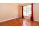 Comfortable bedroom with hardwood floors, a large window, and neutral wall color at 5287 Wild Indigo Way, Acworth, GA 30102