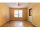 Empty bonus room with tile floors, a window, and a door to the exterior of the home at 5287 Wild Indigo Way, Acworth, GA 30102