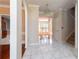 Spacious foyer with marble tile flooring, arched doorways, and views to other rooms at 5287 Wild Indigo Way, Acworth, GA 30102