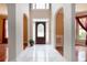 Elegant foyer with tile floors, arched entryways, and a front door with decorative glass at 5287 Wild Indigo Way, Acworth, GA 30102