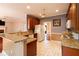 Well-lit kitchen features granite countertops, tile floors, and wood cabinets at 5287 Wild Indigo Way, Acworth, GA 30102