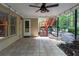 Covered patio includes tile floor, lighting, and access to the backyard area at 5287 Wild Indigo Way, Acworth, GA 30102