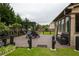 Relaxing backyard patio with a pergola, seating area, and meticulous landscaping creates a private outdoor oasis at 552 Warrenton Run Dr, Sugar Hill, GA 30518