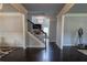 Bright foyer with hardwood floors and a staircase leading to the upper level at 552 Warrenton Run Dr, Sugar Hill, GA 30518