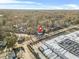 An aerial view of the house nestled in a wooded neighborhood and near a commercial area at 1092 Donnelly Sw Ave, Atlanta, GA 30310