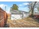 Backyard with a wooden fence, grass and rock landscaping, and gray roof at 1092 Donnelly Sw Ave, Atlanta, GA 30310