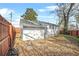 Backyard with a wooden fence, grass and rock landscaping, and gray roof at 1092 Donnelly Sw Ave, Atlanta, GA 30310